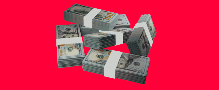 A heap of currency displayed against a bold red background, illustrating the concept of wealth.