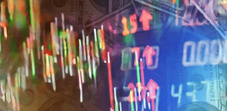 A stock market screen displaying various colorful symbols representing different stocks and market trends.