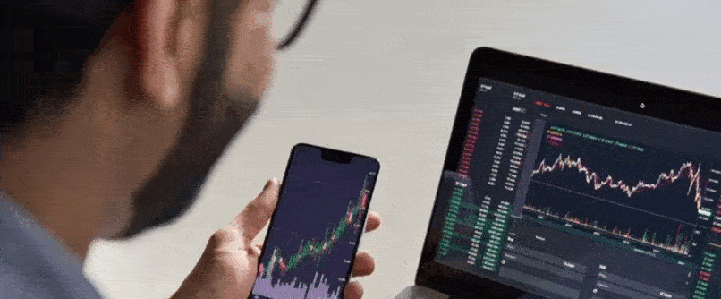 A forex trader studying market trends and data to develop effective money-making strategies in forex trading.