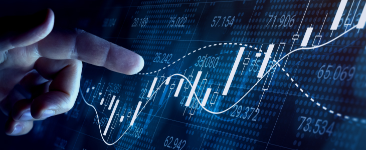 A hand pointing at a stock market graph displayed on a screen, illustrating market trends and fluctuations.