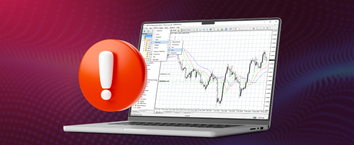 Close-up of a laptop showing forex trading software, with a hand poised over the keyboard.
